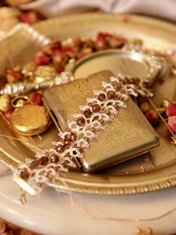 Lavender bracelet showing tatted loops and violet rondelle crystals