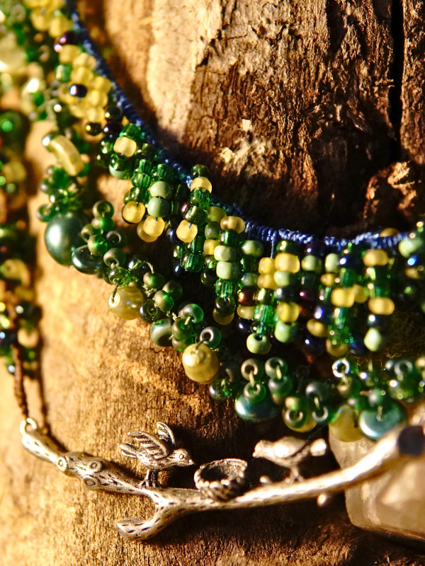 Three-strand tatted woodland necklace in brown, green, and blue hues Botanical necklace with layered tatted strands and bird motif