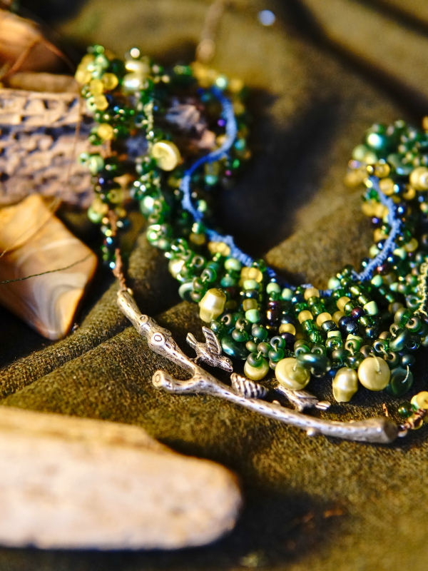 Three-strand tatted woodland necklace in brown, green, and blue hues Woodland statement necklace with layered strands and nest detail