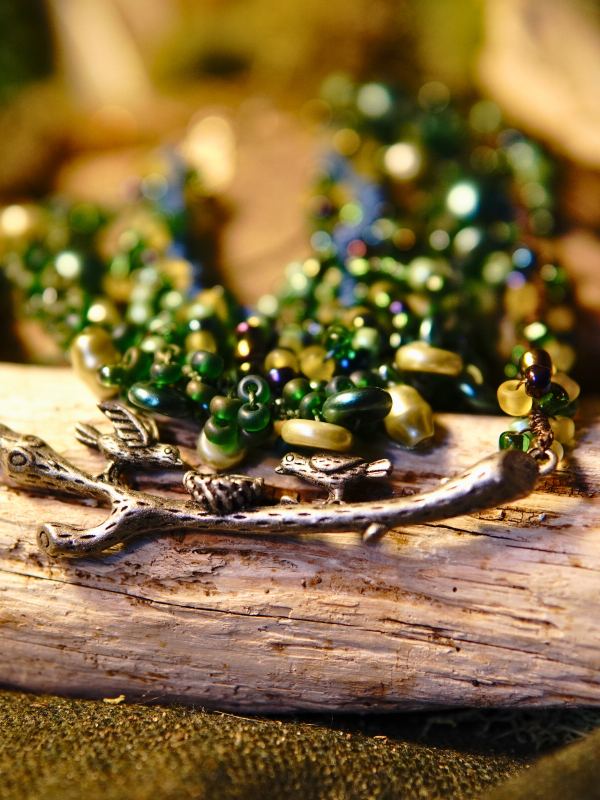 Three-strand tatted woodland necklace in brown, green, and blue hues Green and blue beaded tatted necklace with branch accent