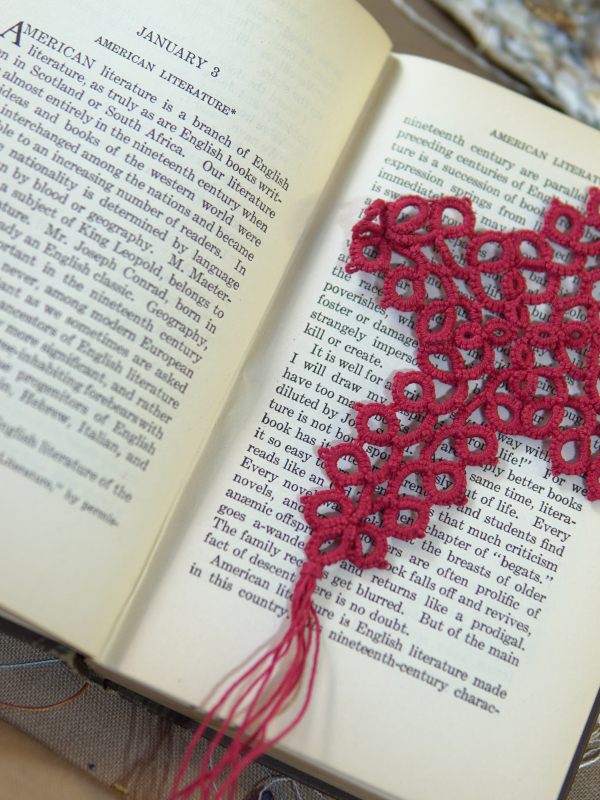 Cranberry Cross Bookmark A rich red tatted lace cross bookmark with fine detail placed across pages