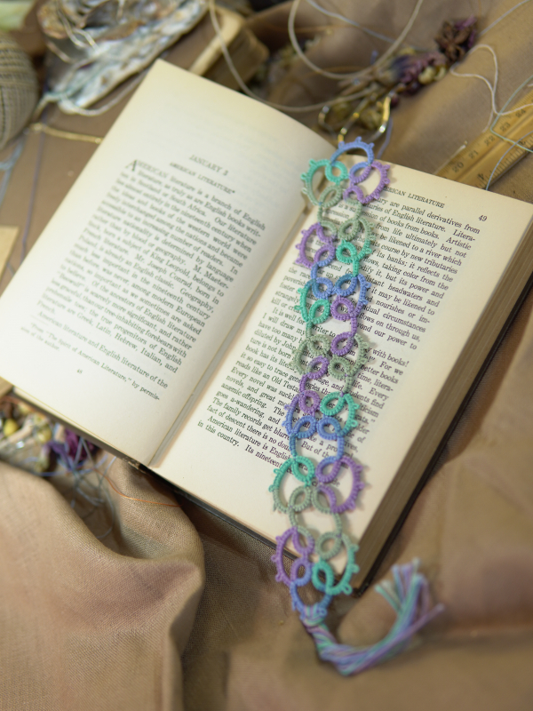Sea & Meadow Bookmark Sea & Meadow tatted lace bookmark in variegated pastels on an open book