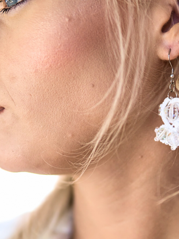 Crystalfathom Earrings – white lace and vintage Swarovski Model wearing Tatted white earrings reflecting soft riverlight