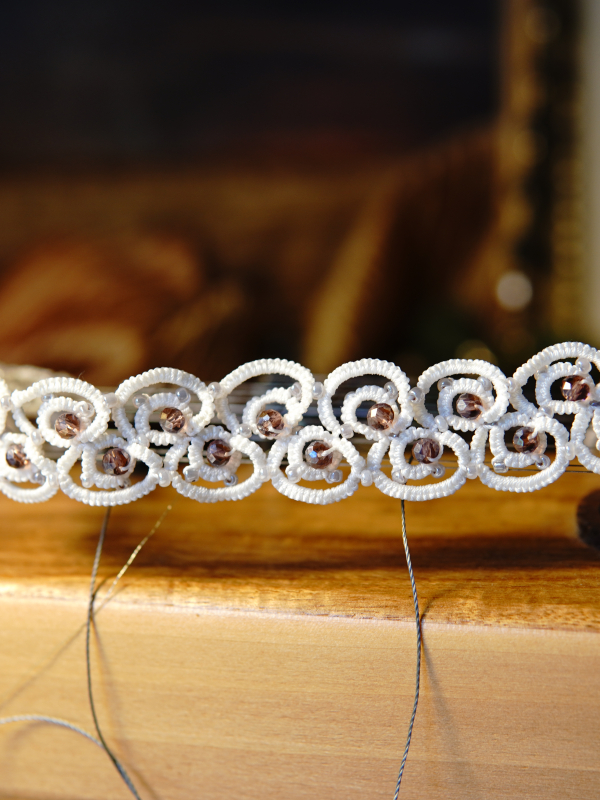 Elarian Bloom Necklace with crystals Close-up of bead details in white lace necklace.