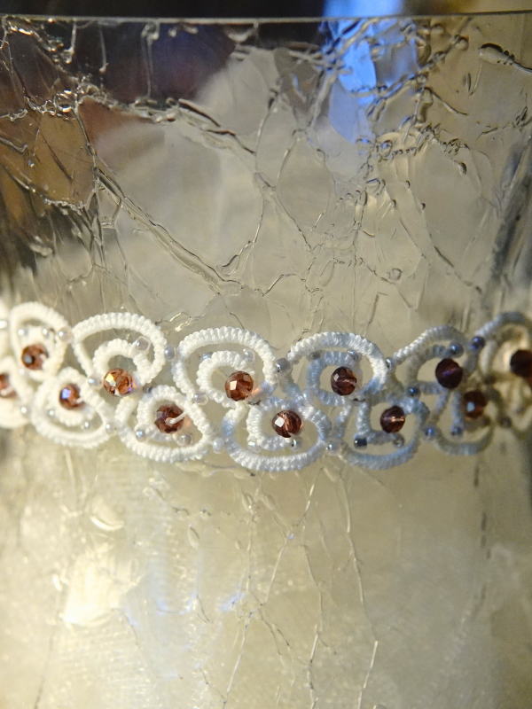 Elarian Bloom Necklace with crystals Elarian Bloom necklace on glass display