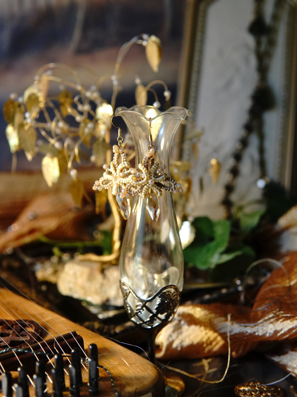 Elegant gold lace earrings with dawnlike shimmer