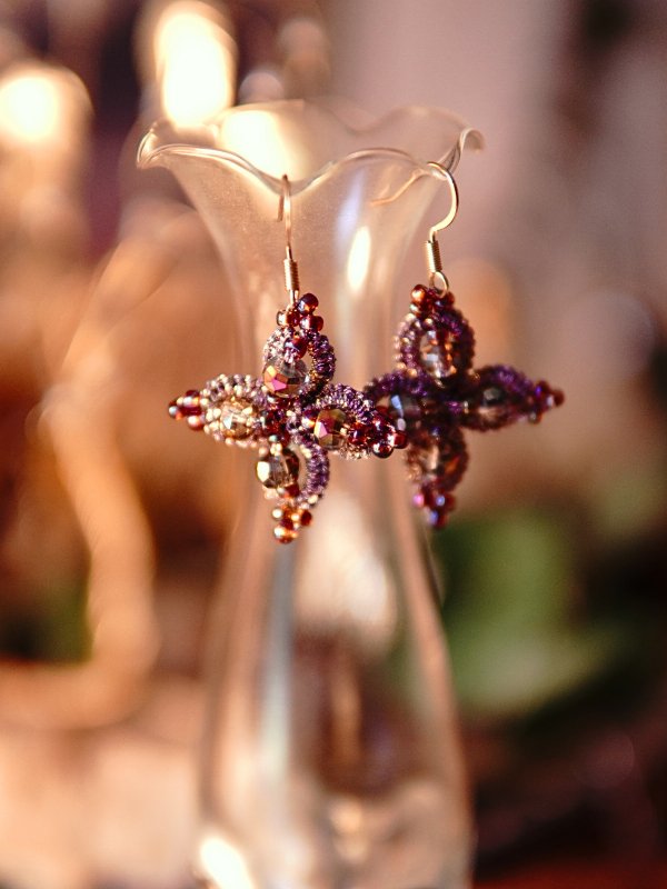 Starweft Blossom tatted lace earrings in pink and crystal Close-up of four-petal lace earrings sparkling in warm light.