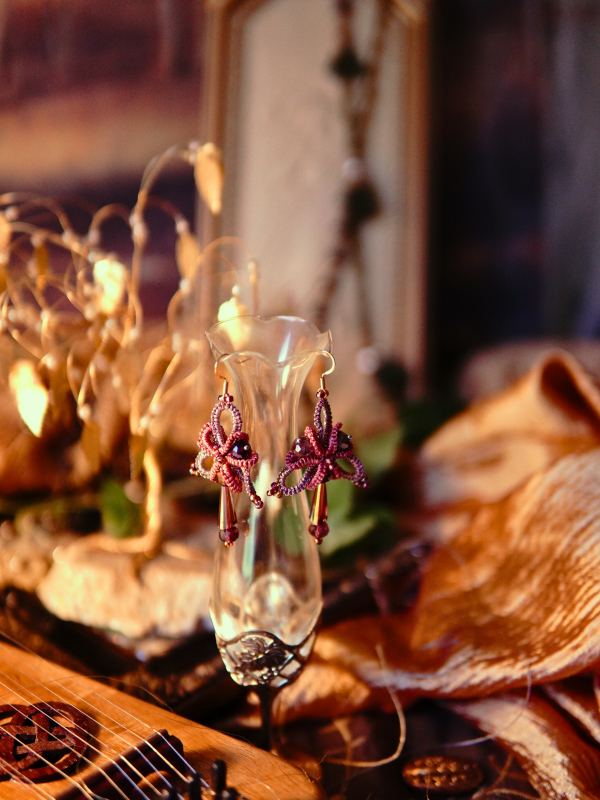 Sylmeriel’s Bloom rose lace earrings with crystal drops Crystal drop lace earrings displayed on vase