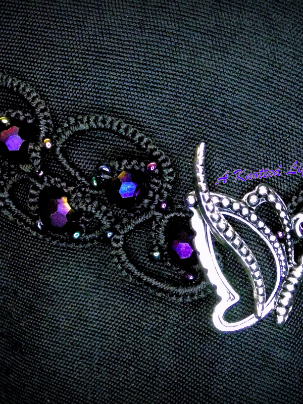 Velasyl’s Bloom tatted lace elven-inspired choker Close-up of beaded black lace choker.