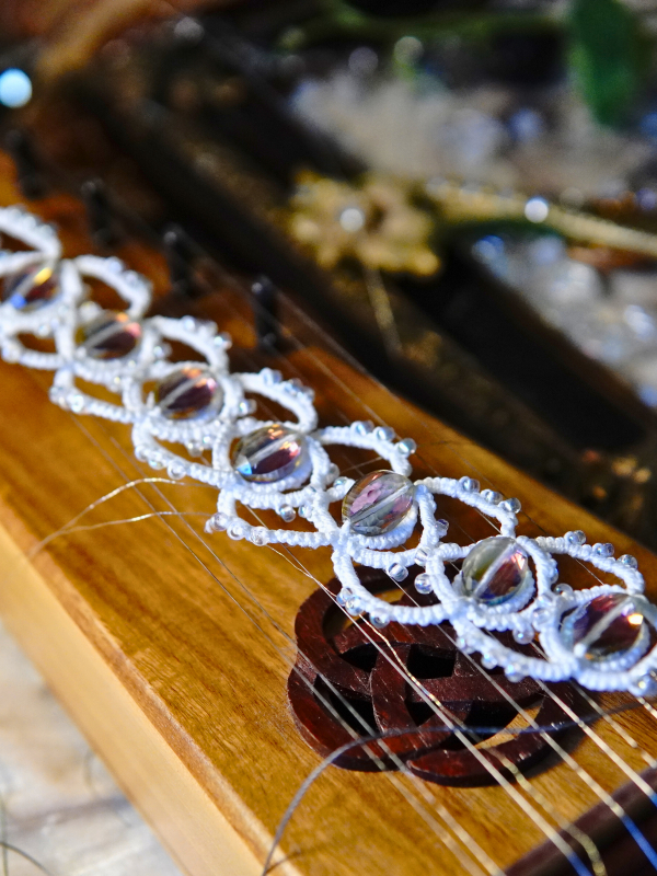 Whisperbind Bracelet – White Tatted Lace with Aurora Borealis Crystals White lace bracelet with iridescent beads