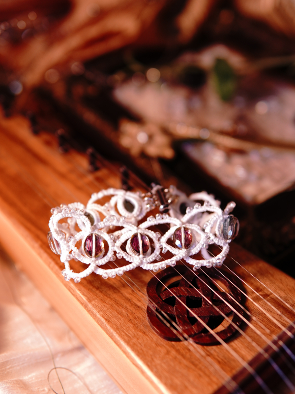 Whisperbind Bracelet – White Tatted Lace with Aurora Borealis Crystals Crystal-accented lace bracelet in soft light