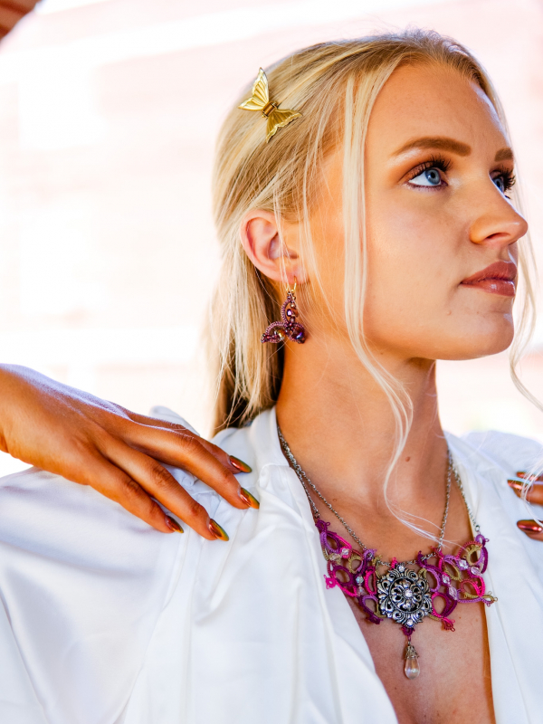 Raspberry Rain tatted necklace with silver sigil and crystal drop Model with elven inspired necklace and earrings in stylized image.