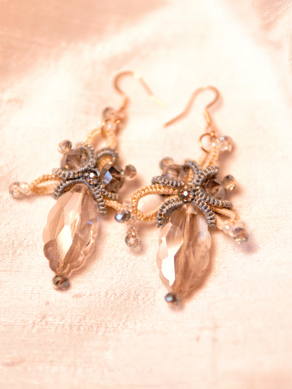 Bright sky-inspired lace earrings from Aeluin Skyglisten earrings on cream backdrop