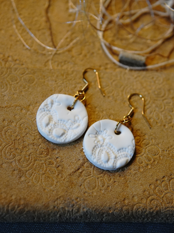 Round Alabaster Impressions earrings with gold wires. 14k gold plated white earrings
