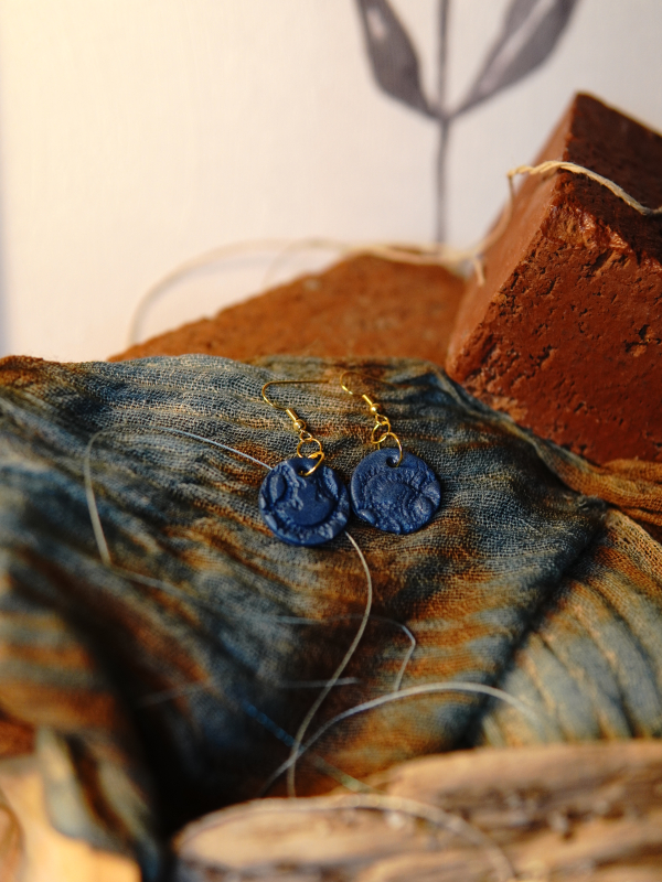 Gold tone artisan blue earrings