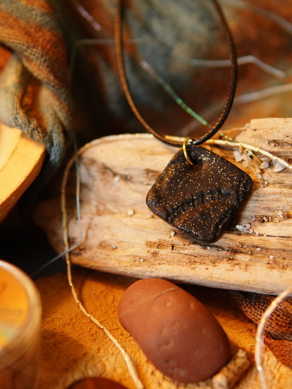 Black clay necklace with silver flecks