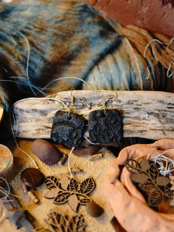 Black clay earrings with gold hooks