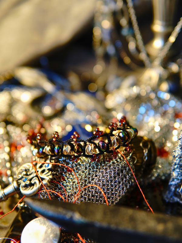 Crown of the Unspoken worn for silent strength Black tatted bracelet with violet edging and gold accents