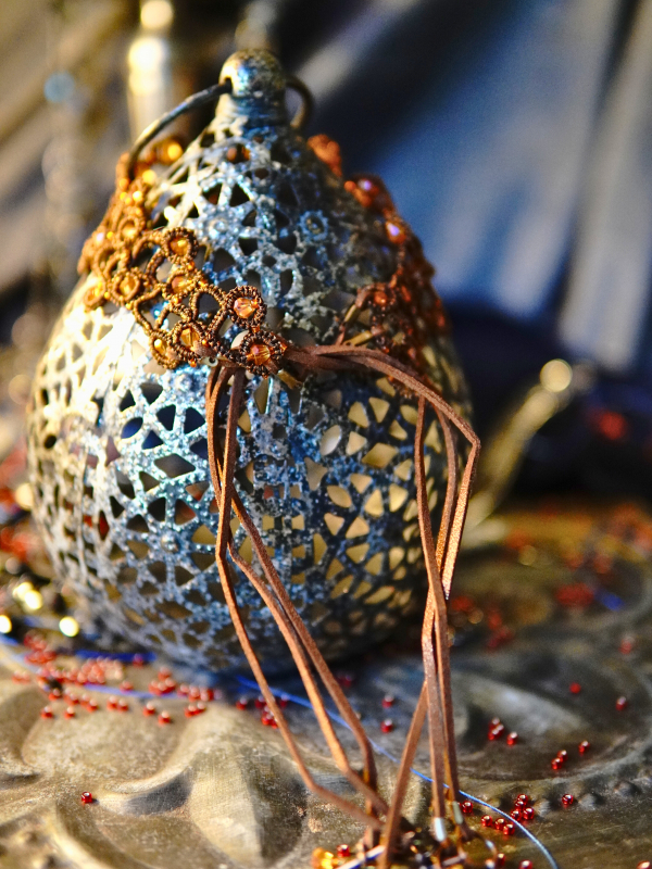 Emberbind necklace with fire-amber beadwork and leather ties Emberbind necklace displayed with suede ties