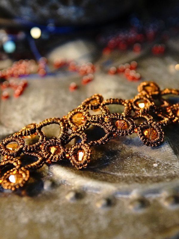 Emberbind necklace with fire-amber beadwork and leather ties Tatted ember-colored necklace with amber beads