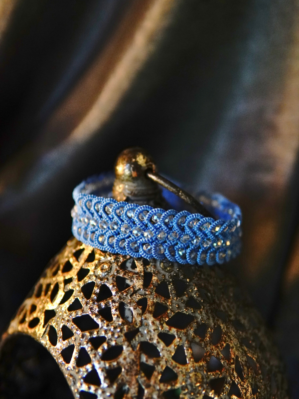 Frostwarden bracelet in icy blue thread Side view of blue tatted bracelet