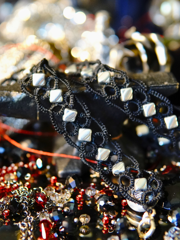 Ironveil Oath—midnight lace and silvered resolve Black tatted lace necklace with silver stones arranged in a soft lattice.