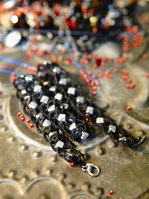 Ironveil Oath—midnight lace and silvered resolve Toggle clasp on black tatted necklace