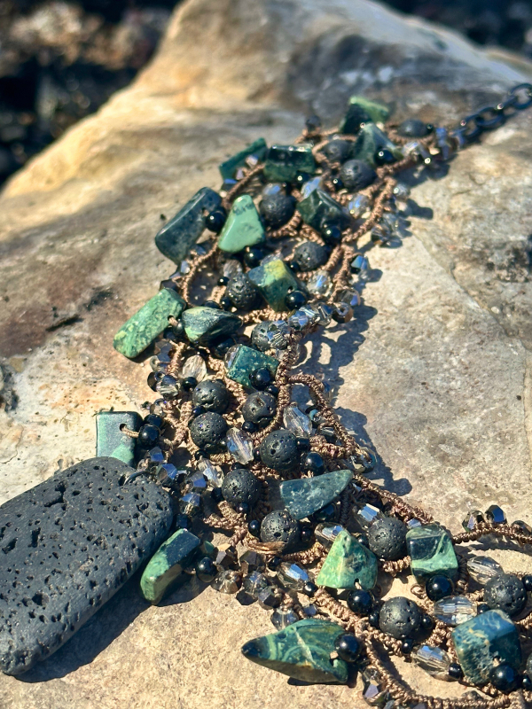 New Beginnings tatted necklace – lava stone & serpentine Close-up of New Beginnings necklace with lava stone and crystals