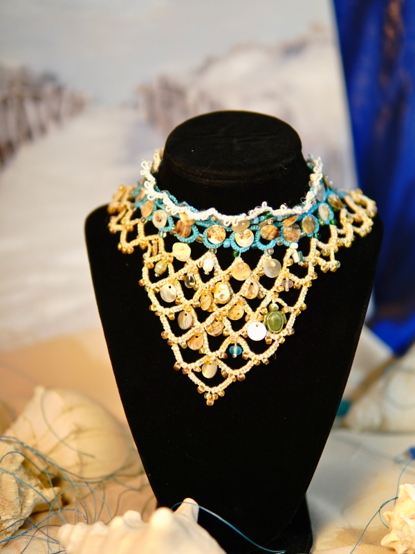 Sandy Treasures necklace, tatted lace with shells, pearls, and glass with gold.