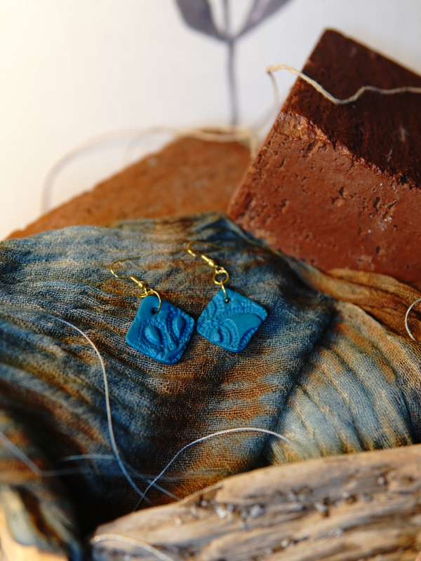 Small diamond shaped artisan earrings. Small lace impression earrings