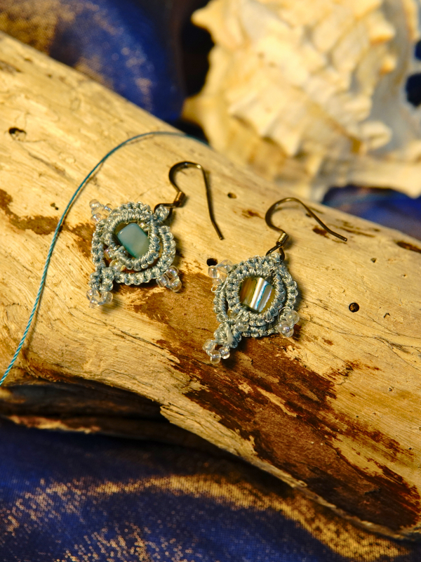 Aqua seashell and aurora borealis beads in hand-tatted lace design.