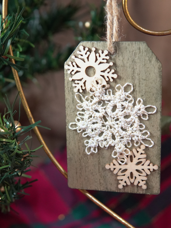 Delicate tatted snowflake winter tag Handmade lace snowflake on rustic wood tag