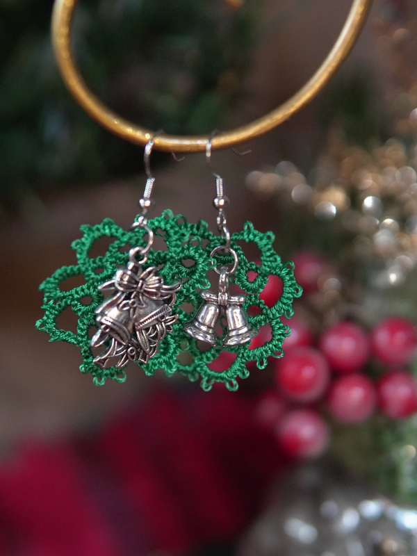 Tatted wreath earrings Green tatted wreath earrings with mixed bell charms on display