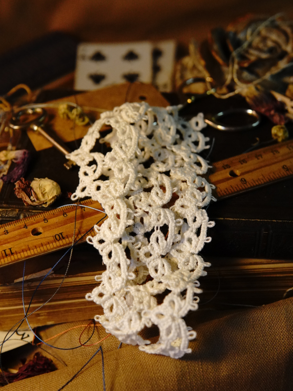 Heirloom Cluster Lace Intricate white tatted lace cluster displayed on everyday items