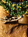 Green and brown beaded lace necklace with silver branch focal