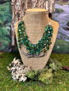 Woodland necklace with silver branch and green beaded strands