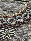 Close-up of woodland necklace with serpentine and peridot