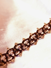 Brown lace and gold crystal bracelet on fabric