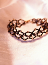 Tatted bracelet with warm amber-like crystals