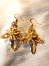 Handmade champagne lace earrings on cream fabric