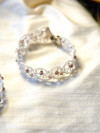 Close-up of tatted bracelet loops and crystals.