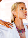 Model with elven inspired necklace and earrings in stylized image.