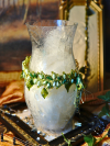 Leaf-crown necklace wrapped around frosted vase for display