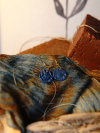 Gold tone artisan blue earrings