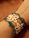 Tatted lace daisy bracelet in green white, and yellow threads