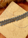 Skythread Tatted Lace Bracelet on warm neutral stone tile