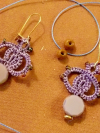Detailed shot of Bloomdrop earrings showing threadwork.