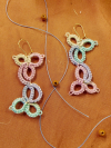 Tatted lace earrings in pastel ombre on parchment background