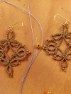 Trellis Dance Tatted Lace Earrings in Brown Close-up of threadwork and beads in a Wanderthread-style lace earring.