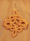 Trellis Dance Tatted Lace Earrings in Terracotta Close-up of handcrafted orange Trellis Dance lace earrings